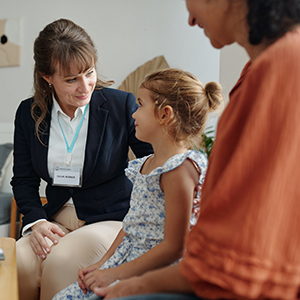Social Worker Visiting To Family At Home