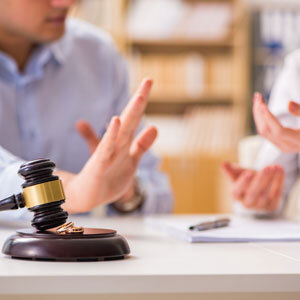 Legal dispute with gavel symbolizing divorce proceedings.